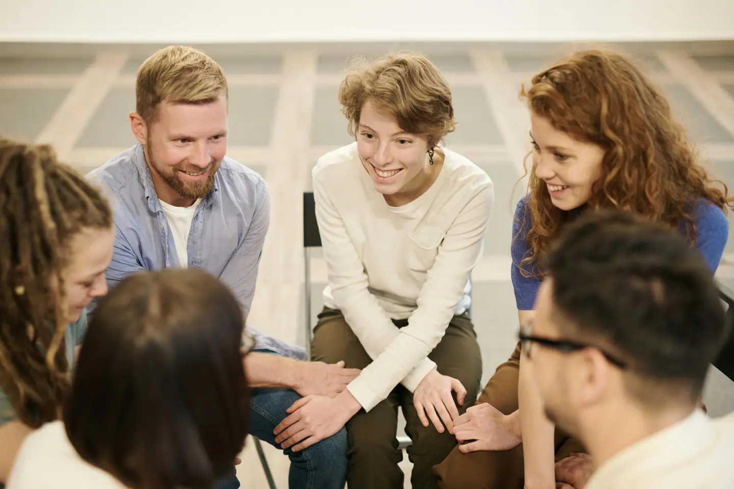 Colleagues smiling together in a meeting